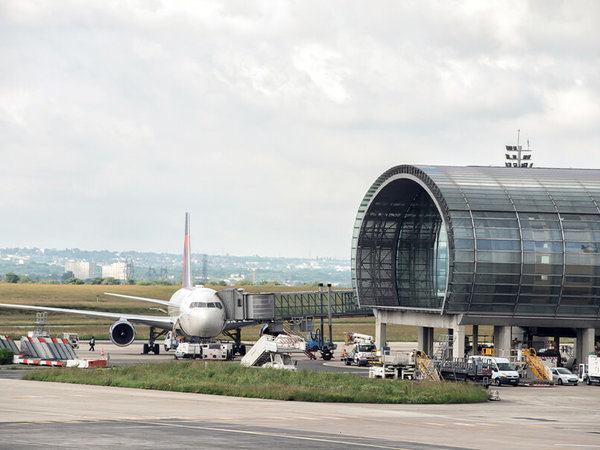Aircraft on the ground at Paris-Charles-de-Gaulle airport during the day.